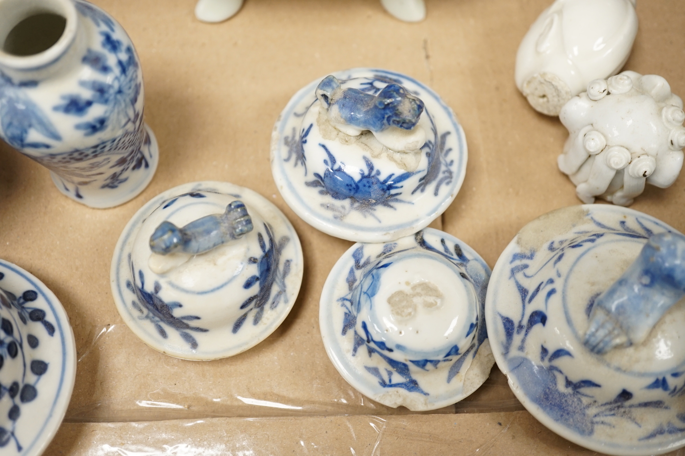 A collection of 18th - early 20th century Chinese blue and white porcelain vases, jars and spare covers, together with some Japanese blue and white ceramics, tallest 21cm